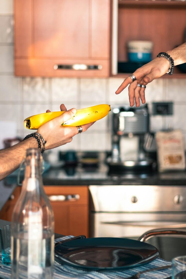 A Man Sharing A Ripe Banana