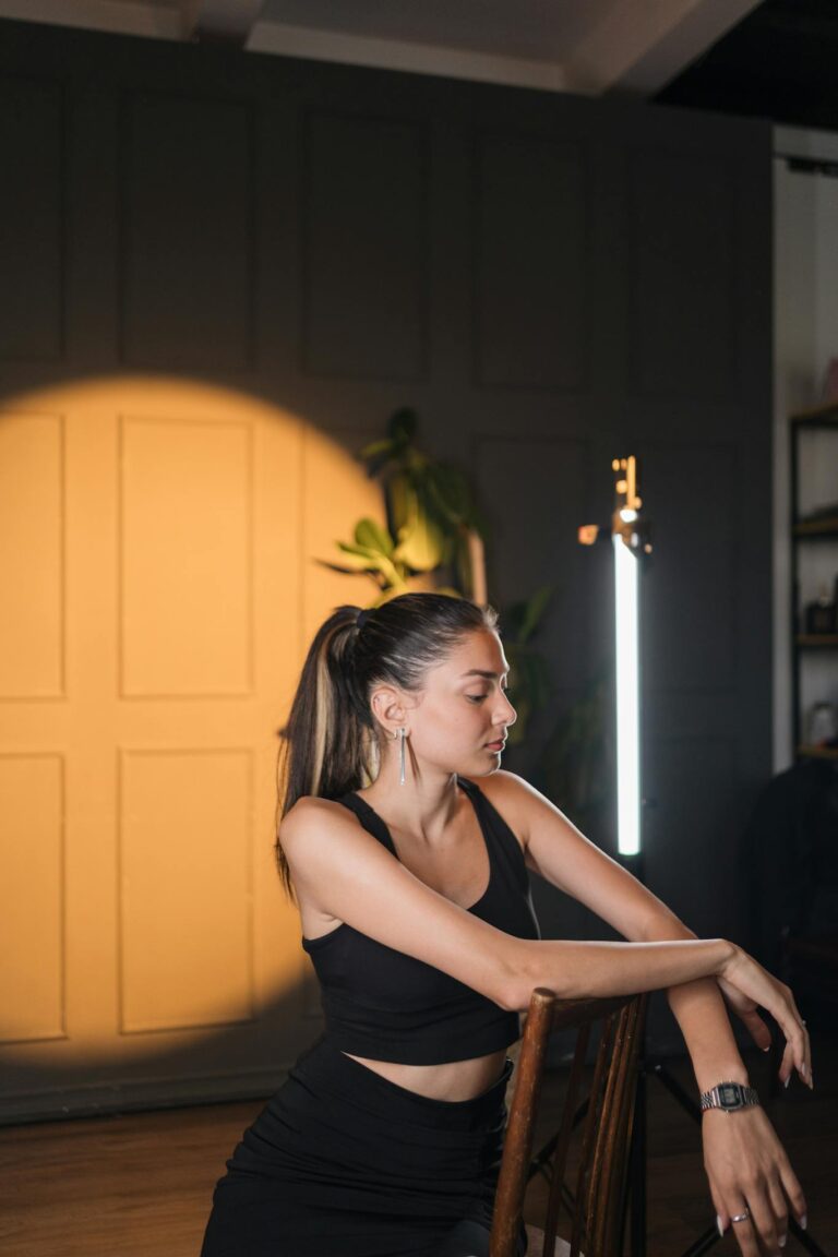 Woman in Black Clothes Standing with Eyes Closed